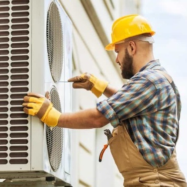 A Technician Installs an Air Conditioner.